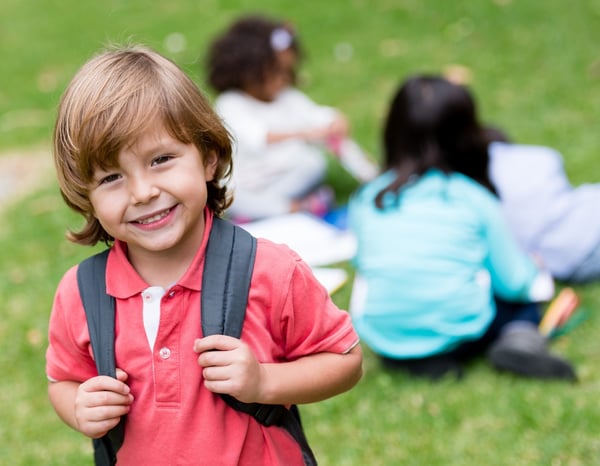 happy boy wearing backpack