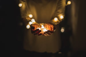person holding lights christmas