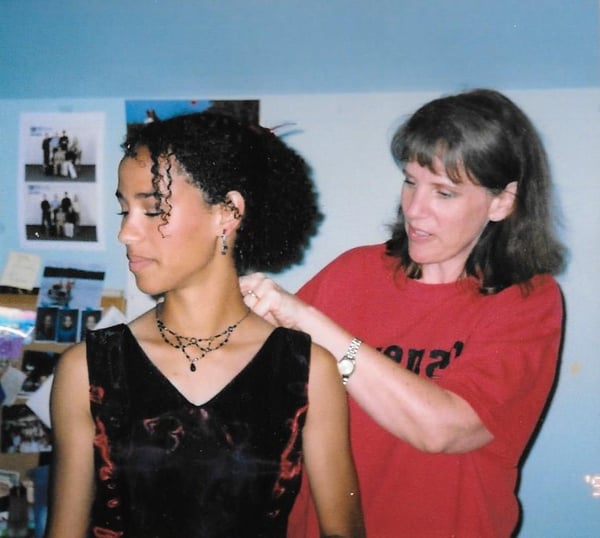 mom helping daughter get ready