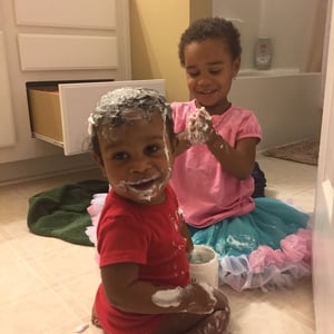 grandchildren playing bathroom floor